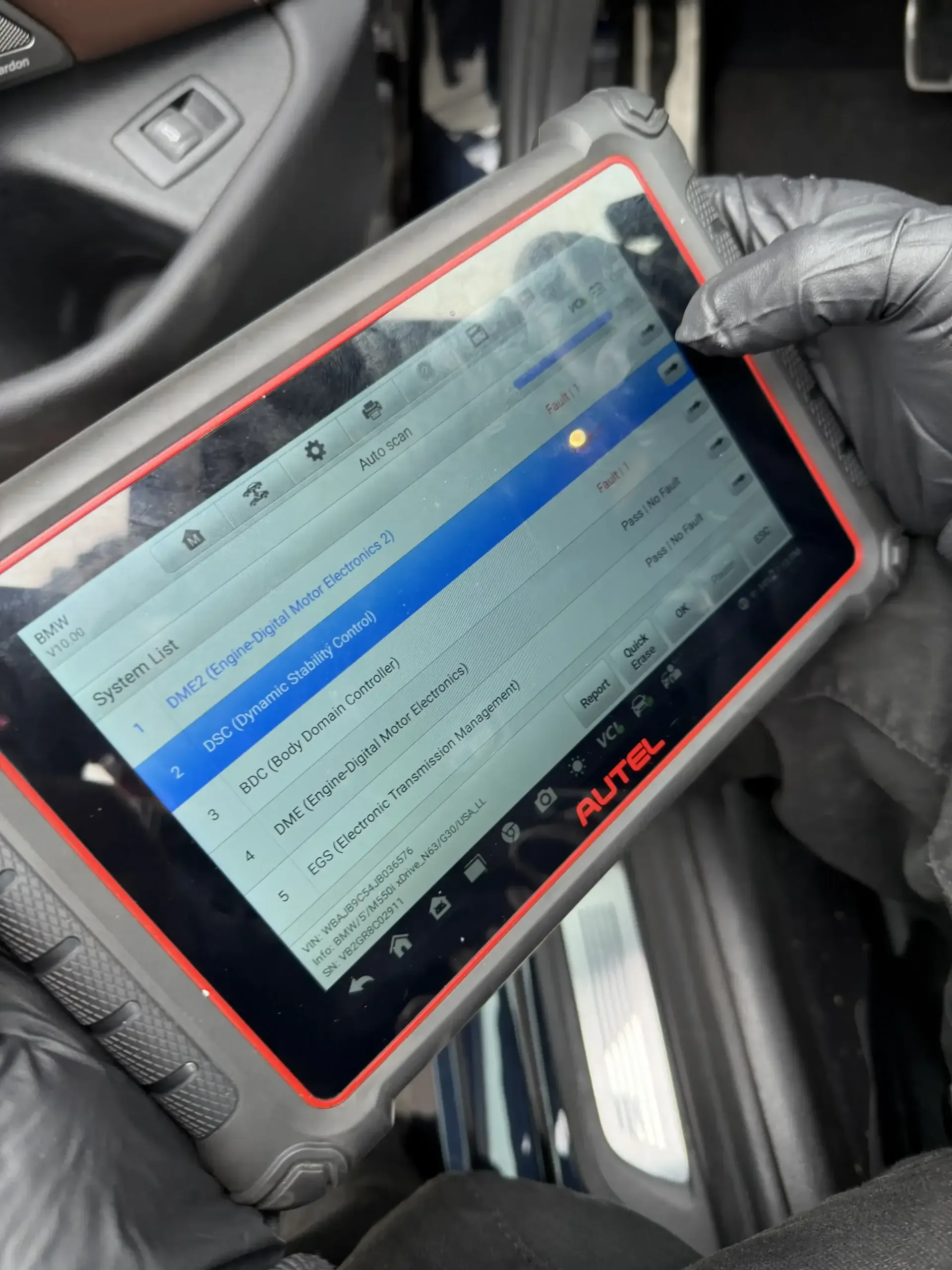Autel diagnostic scanner showing BMW M550i (G30 N63 V8) system scan with fault codes at Beacon Auto Care San Mateo