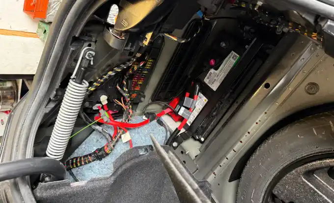 Trunk-mounted battery replacement on a European car at Beacon Auto Care San Mateo