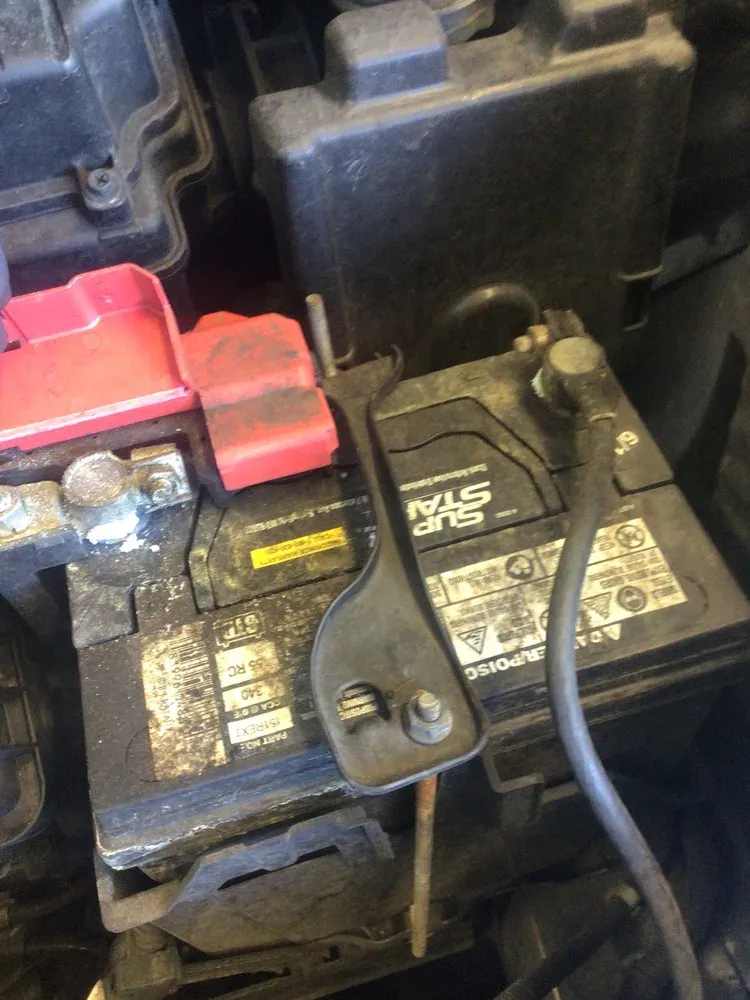Corroded battery terminals during scheduled maintenance inspection at Beacon Auto Care San Mateo