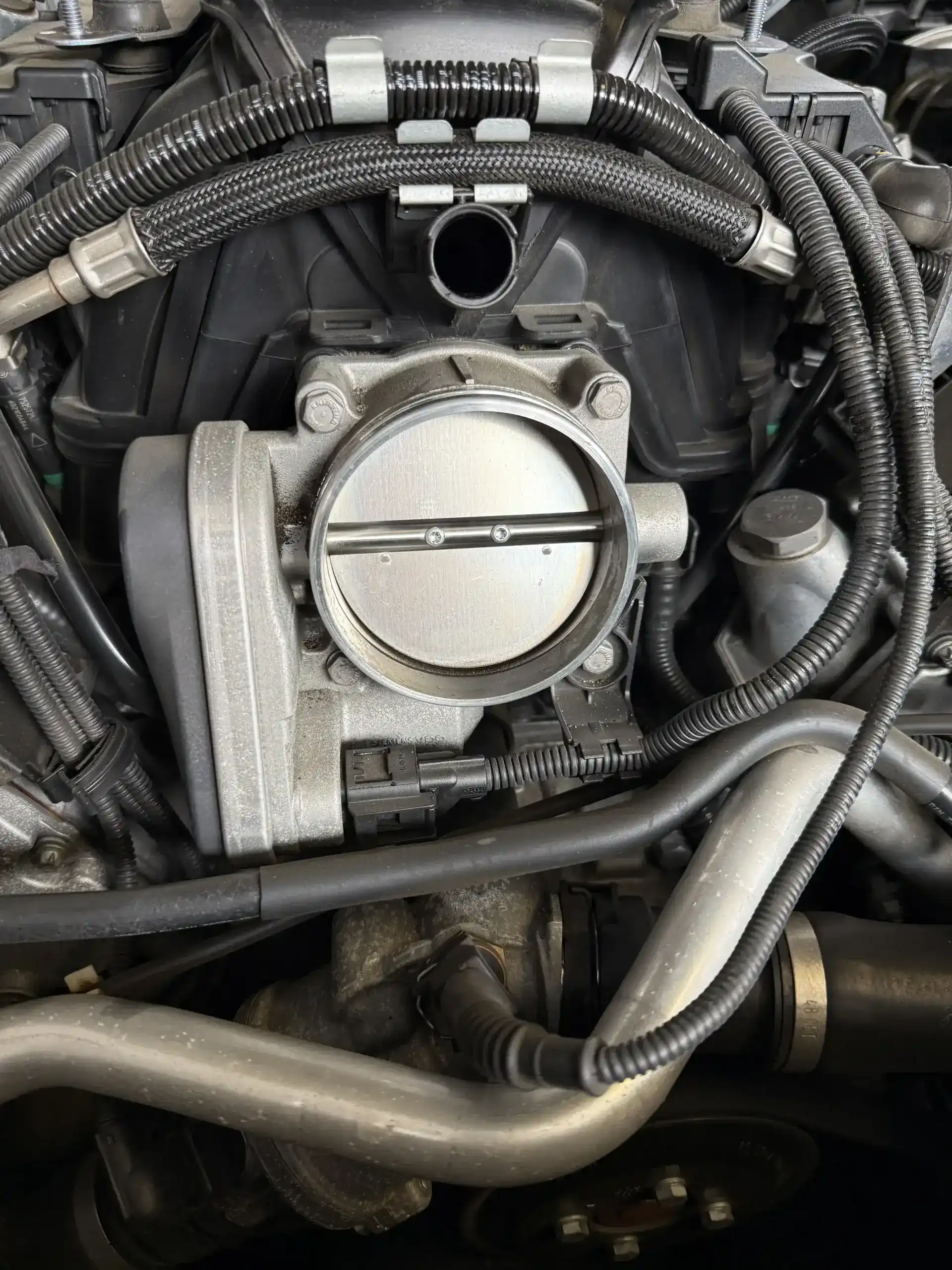 BMW V8 throttle body cleaning during a tune-up service