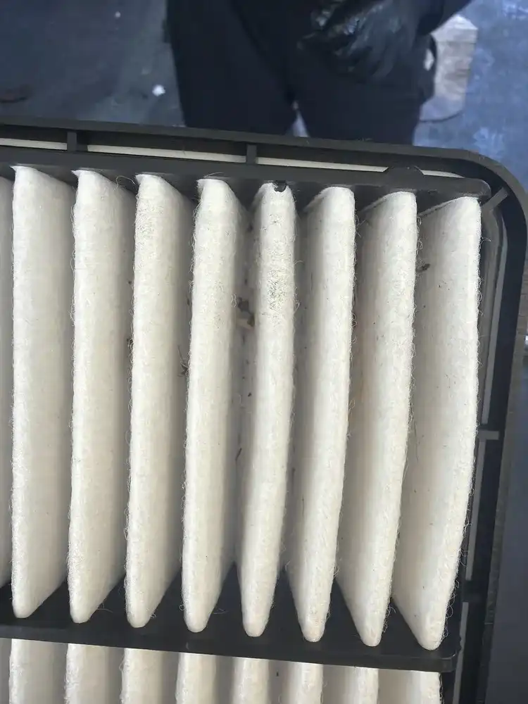 Dirty engine air filter pulled during inspection at Beacon Auto Care San Mateo