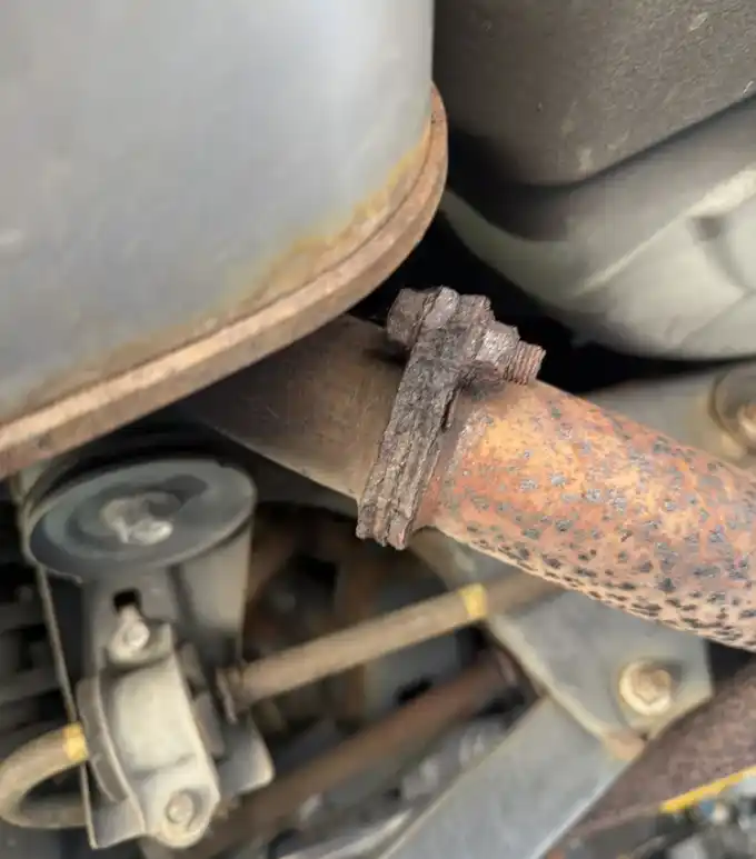 Rust and corrosion buildup on an exhaust system inspected on the lift at Beacon Auto Care San Mateo