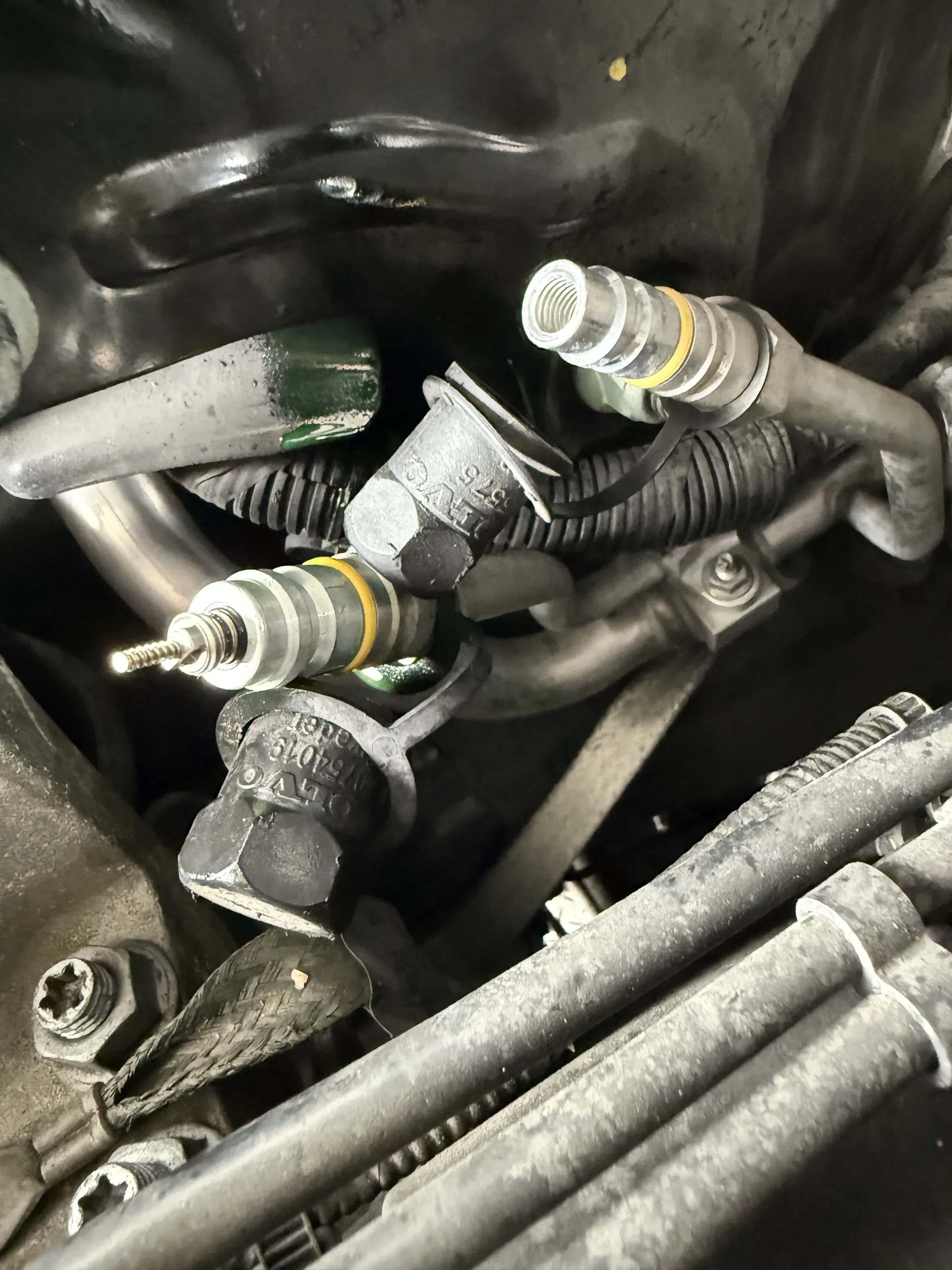 New A/C service-port valve core installed on a Land Rover at Beacon Auto Care San Mateo