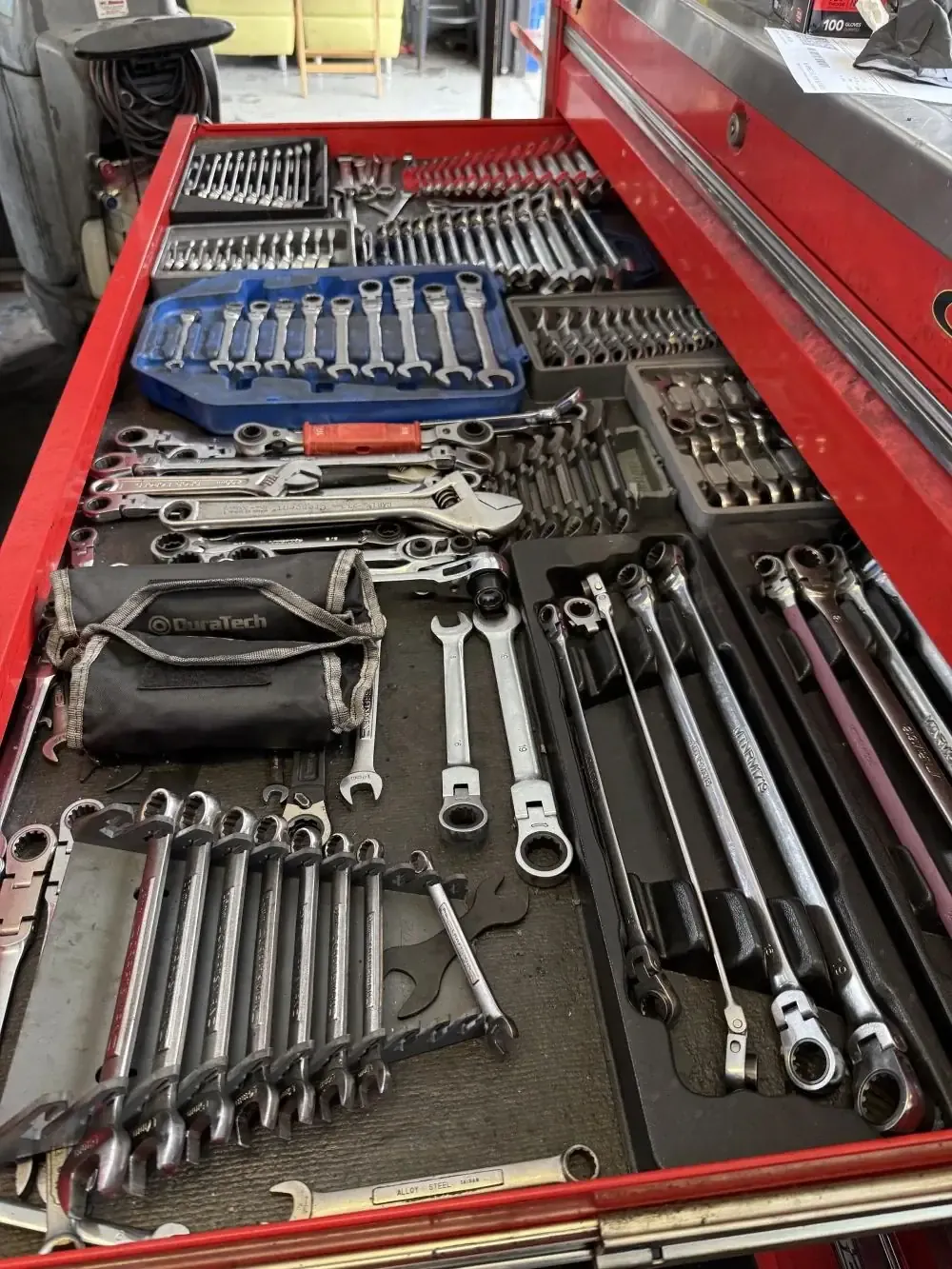 Working mechanic tool drawer with combination, ratcheting, and flare-nut wrenches at Beacon Auto Care San Mateo