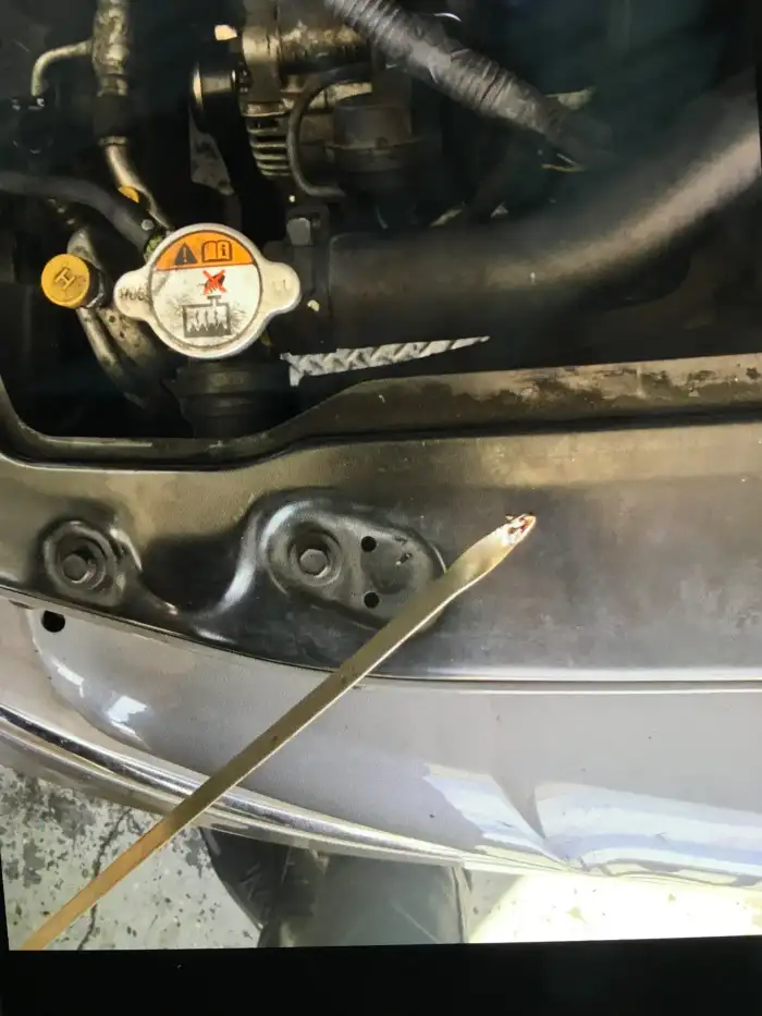 Bone-dry oil dipstick from a 2013 Hyundai Sonata — no oil registering, found during a digital vehicle inspection in San Mateo