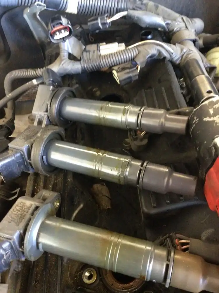 Worn spark plugs oil-fouled — misfire diagnosis at Beacon Auto Care San Mateo
