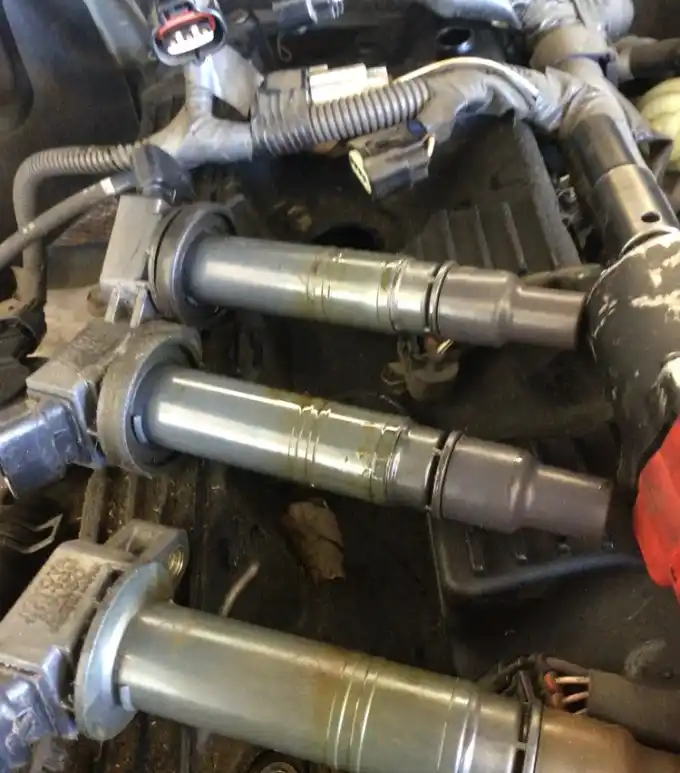 Worn oil-fouled spark plugs at Beacon Auto Care San Mateo