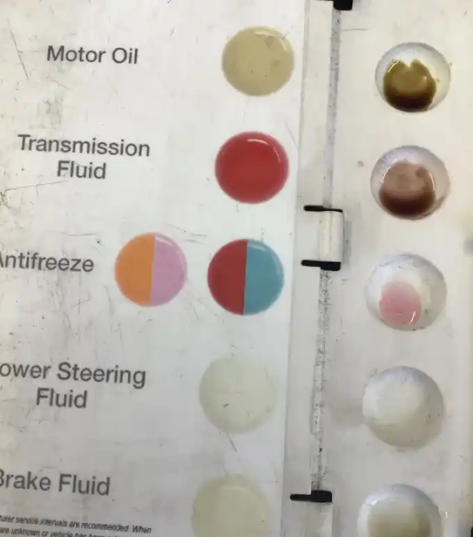 Dark, burnt transmission fluid pulled during a service at Beacon Auto Care San Mateo