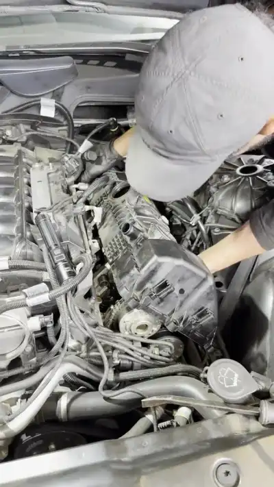 BMW inline-six engine with the valve cover removed — shop clip thumbnail