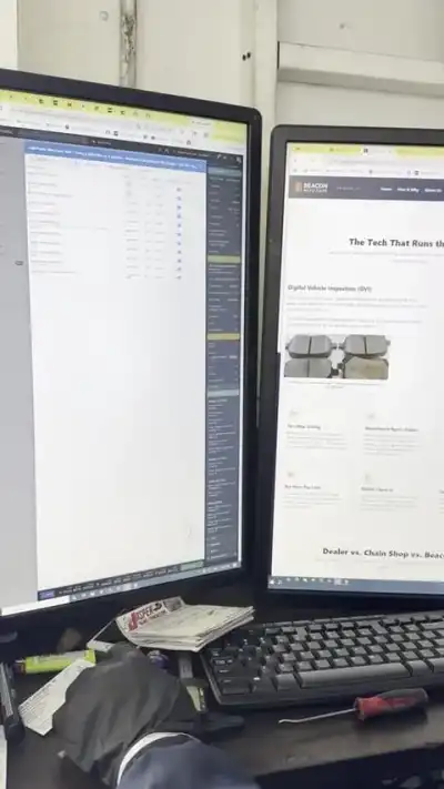 Tekmetric shop-management software and a digital vehicle inspection open on dual monitors — shop clip thumbnail
